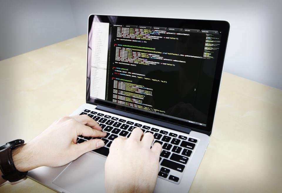 Developer working on a business website project on a laptop