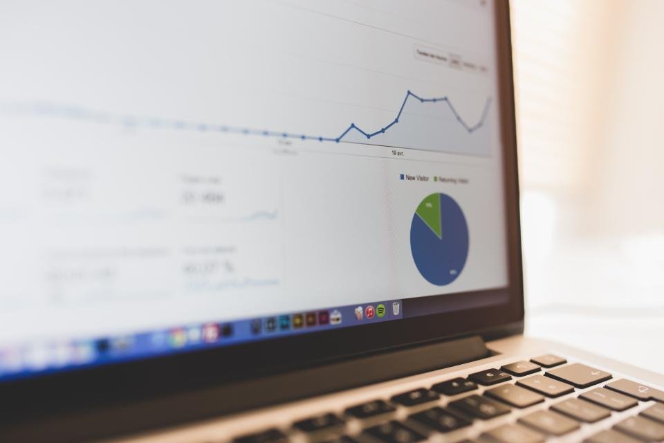 Laptop displaying website analytics for a local SEO campaign